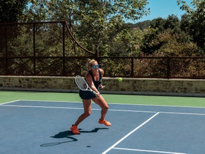 Image of a Playtester hitting a volley