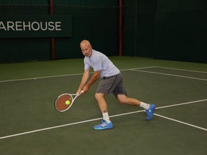 Image of a Playtester Hitting a Backhand Volley