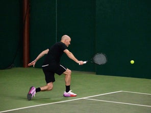 Image of Playtester Hitting a One-Handed Backhand