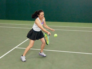 Image of playtester hitting a volley
