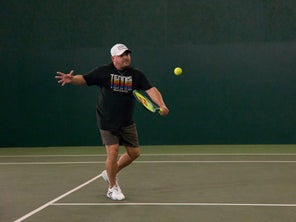 Image of Playtester Hitting a Backhand Volley