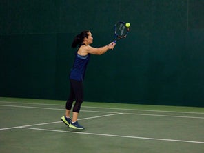 Image of a Playtester Hitting a Backhand Volley