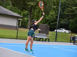 Image of a Playtester Hitting a Serve
