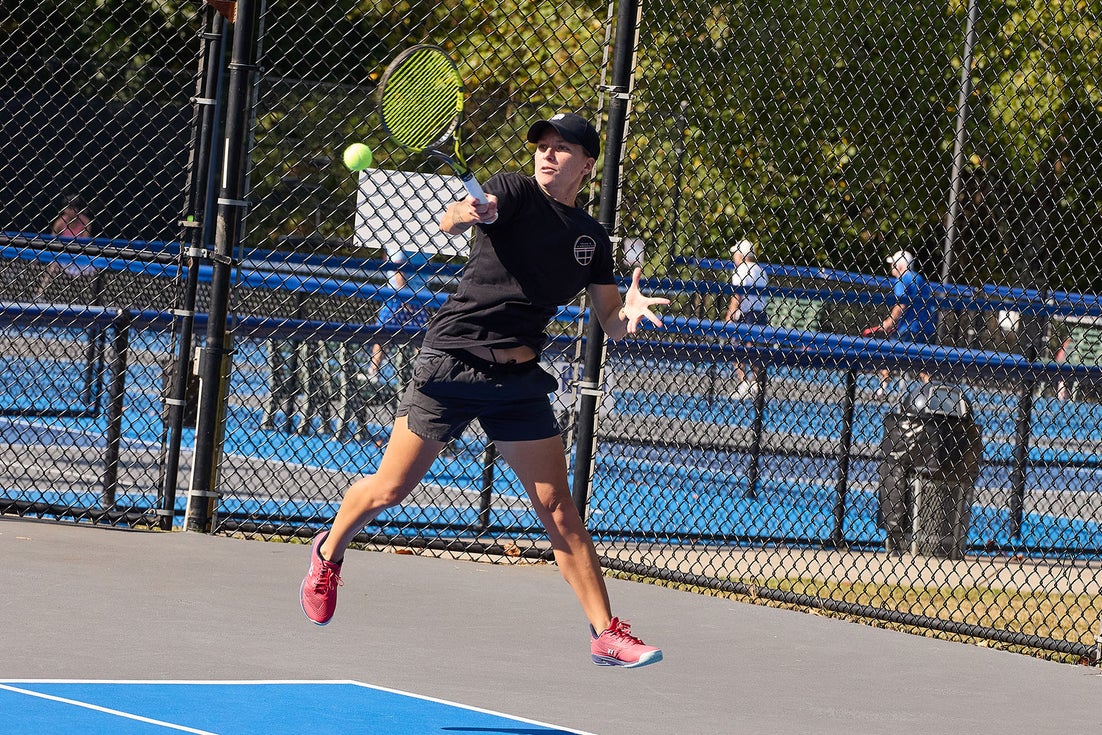 Woman hitting a jumping forehand